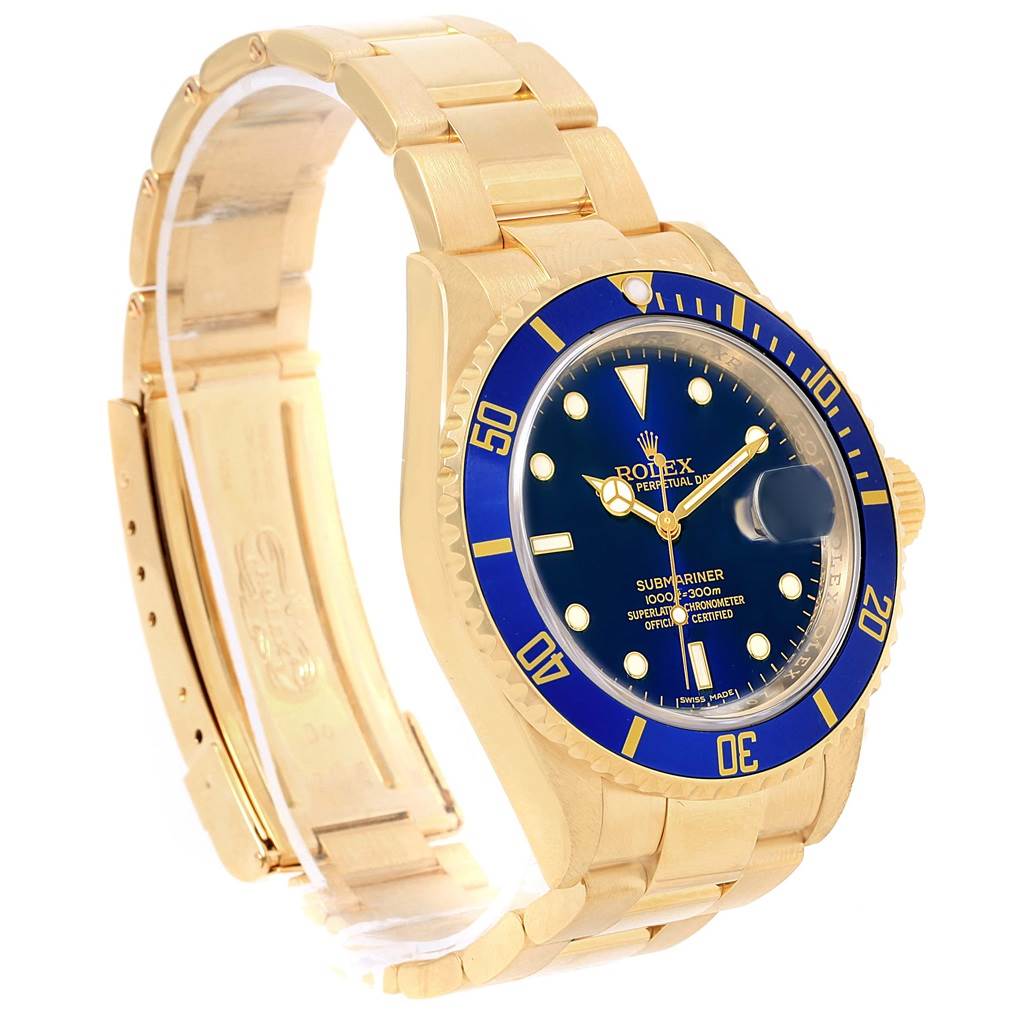 The image shows an angled side view of a Rolex Submariner 16618 Men's Yellow Gold Blue Dial 16618 Men's Yellow Gold Blue Dial watch, highlighting its gold bracelet, blue bezel, and blue dial.