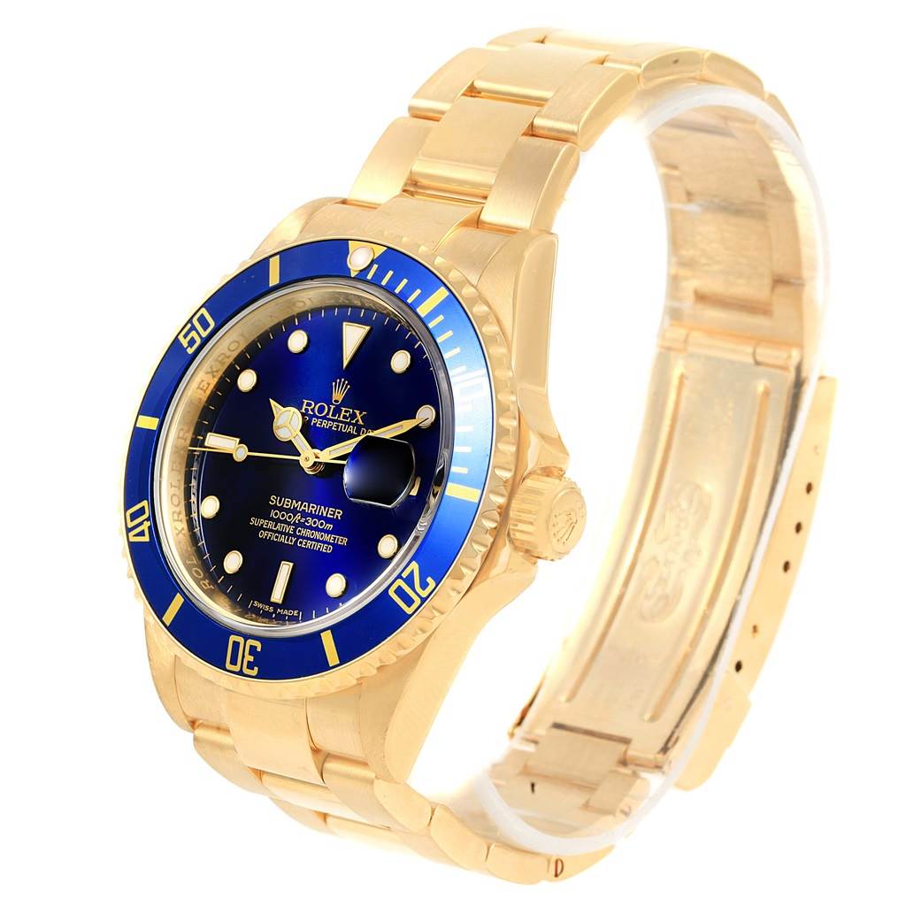 The image shows a Rolex Submariner 16618 Men's Yellow Gold Blue Dial 16618 Men's Yellow Gold Blue Dial watch angled to display the face, bezel, and part of the bracelet.