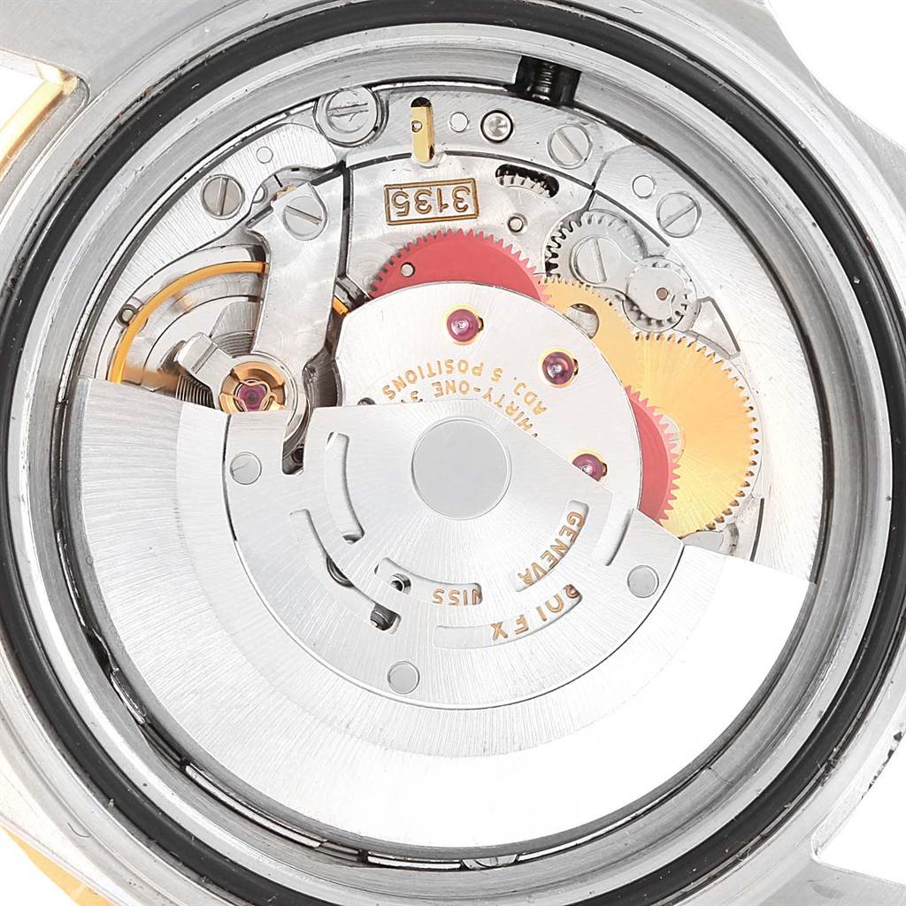 This image shows the inner mechanical movement of a Rolex Submariner 16613 Men
s Steel and Gold (two tone) Purple Dial 16613 Men
s Steel and Gold (two tone) Purple Dial watch viewed from the back.