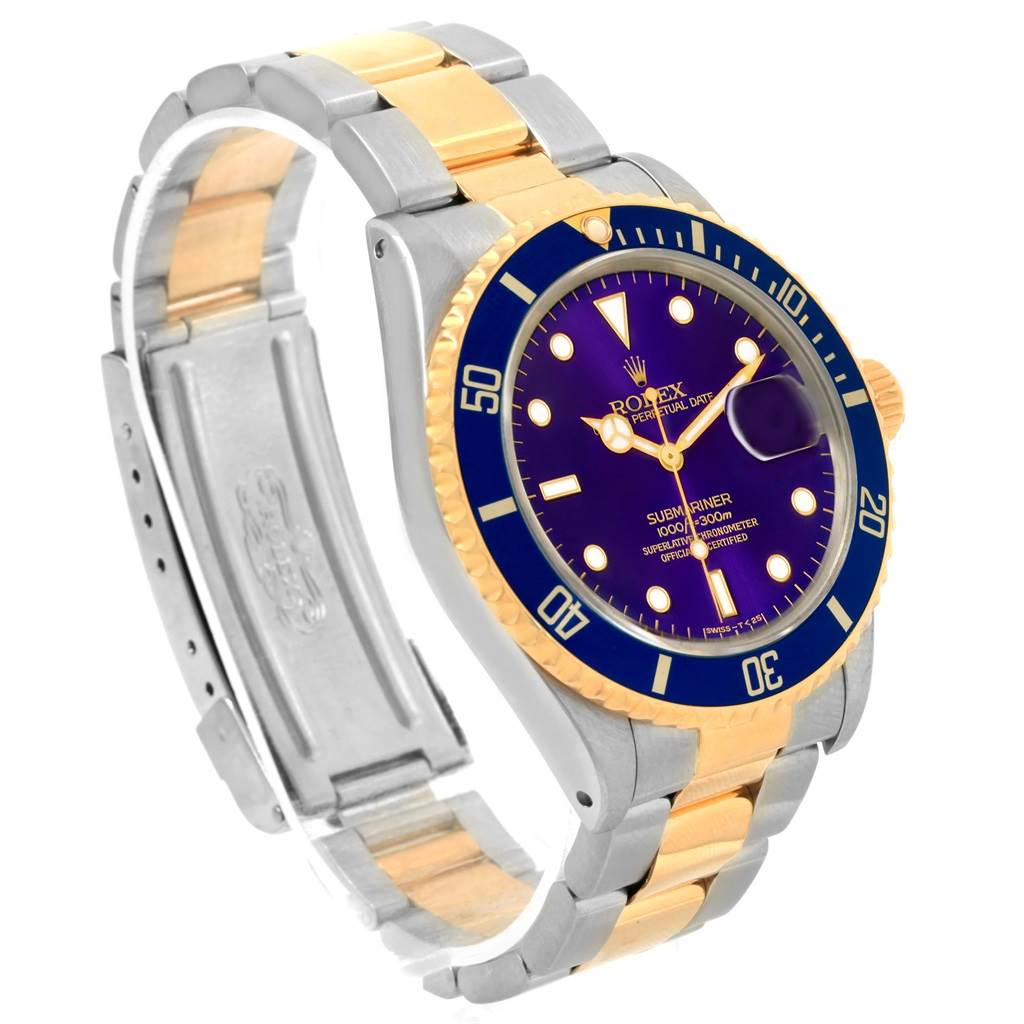 The image shows a Rolex Submariner 16613 Men
s Steel and Gold (two tone) Purple Dial 16613 Men
s Steel and Gold (two tone) Purple Dial watch at an angle displaying the face, bezel, and full bracelet.