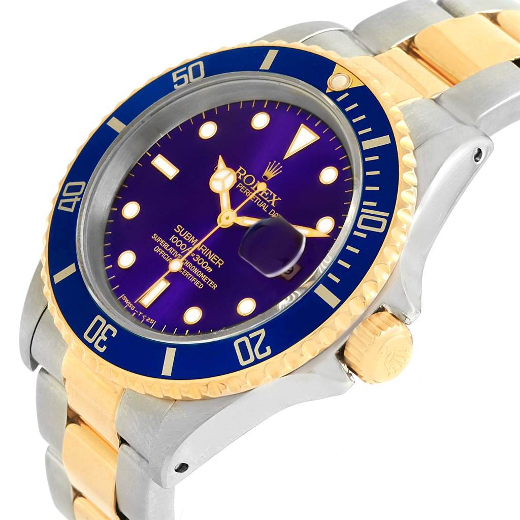 The image shows a Rolex Submariner 16613 Men
s Steel and Gold (two tone) Purple Dial 16613 Men
s Steel and Gold (two tone) Purple Dial watch at an angled close-up, highlighting the dial, bezel, and part of the bracelet.