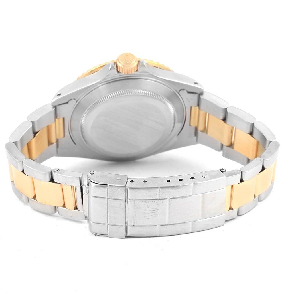 The image shows the back view of a Rolex Submariner 16613 Men
s Steel and Gold (two tone) Purple Dial 16613 Men
s Steel and Gold (two tone) Purple Dial watch, highlighting the case back, crown, and two-tone bracelet clasp.