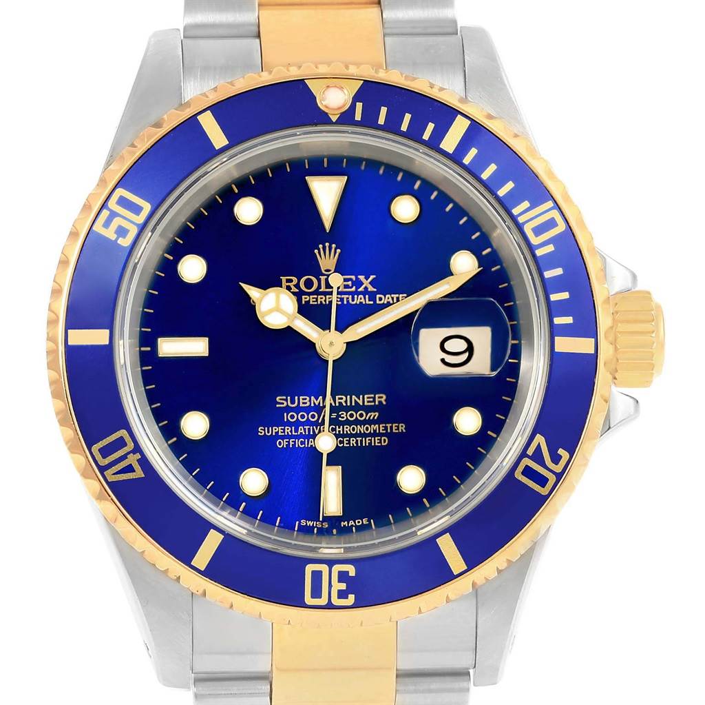 This photo shows a front view of the Rolex Submariner 16613 Men's Steel and Gold (two tone) Blue Dial 16613 Men's Steel and Gold (two tone) Blue Dial watch, highlighting its blue dial, bezel, and two-tone bracelet.