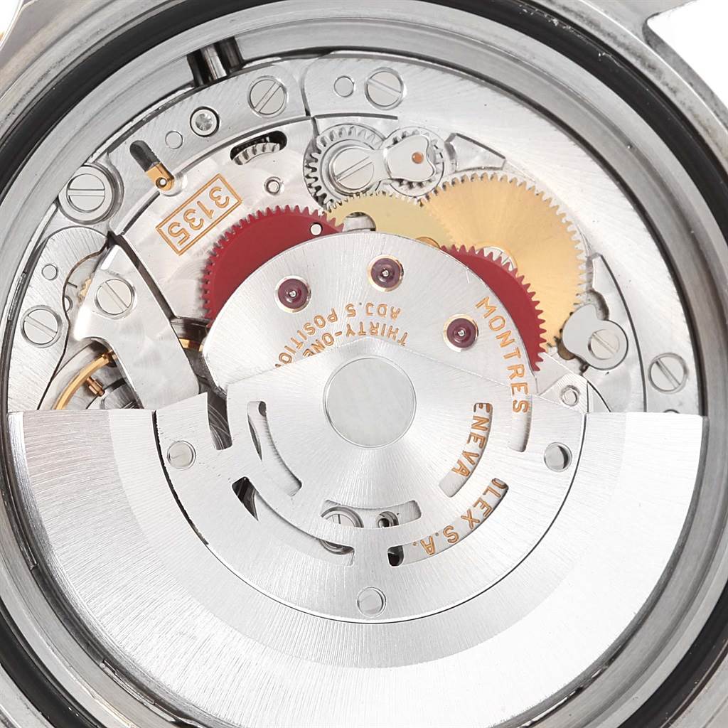 This image shows the internal mechanism of a Rolex Submariner 16613 Men's Steel and Gold (two tone) Blue Dial 16613 Men's Steel and Gold (two tone) Blue Dial, focusing on the detailed parts of the movement.