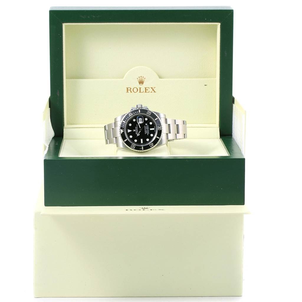 The Rolex Submariner 116610 Men's Stainless Steel Black Dial 116610 Men's Stainless Steel Black Dial watch is shown from the front in its green and beige presentation box.
