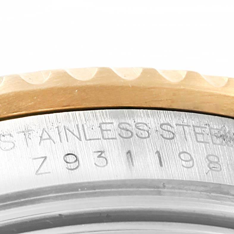 The image shows a close-up of the case back edge and serial number engraving of a Rolex Submariner 16613 Men's Steel and Gold (two tone) Blue Dial 16613 Men's Steel and Gold (two tone) Blue Dial.