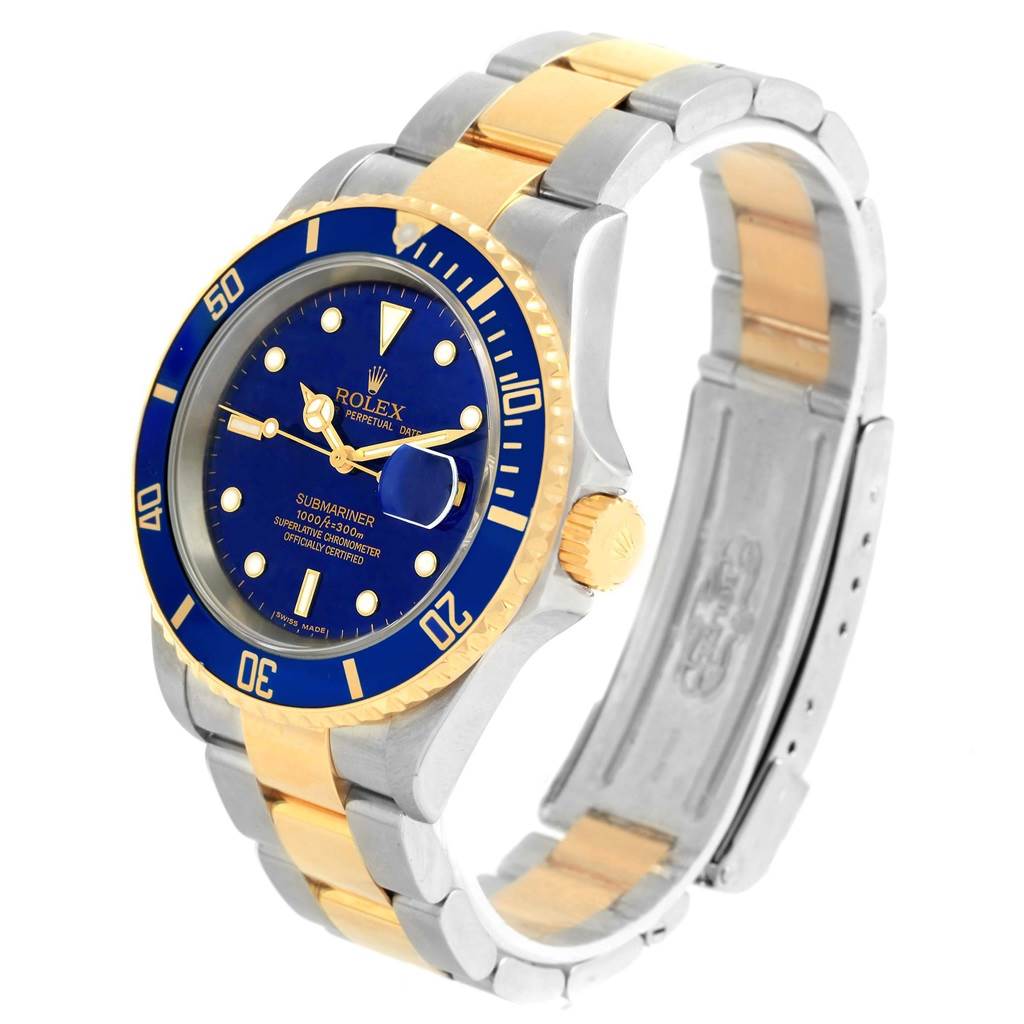 The image shows a Rolex Submariner 16613 Men's Steel and Gold (two tone) Blue Dial 16613 Men's Steel and Gold (two tone) Blue Dial watch at a three-quarter angle, showcasing the dial, bezel, crown, and strap.