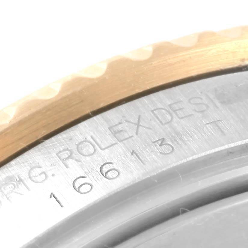 The image shows a close-up of the case back and bezel of a Rolex Submariner 16613 Men's Steel and Gold (two tone) Champagne Dial 16613 Men's Steel and Gold (two tone) Champagne Dial, highlighting the model number and engraved text.