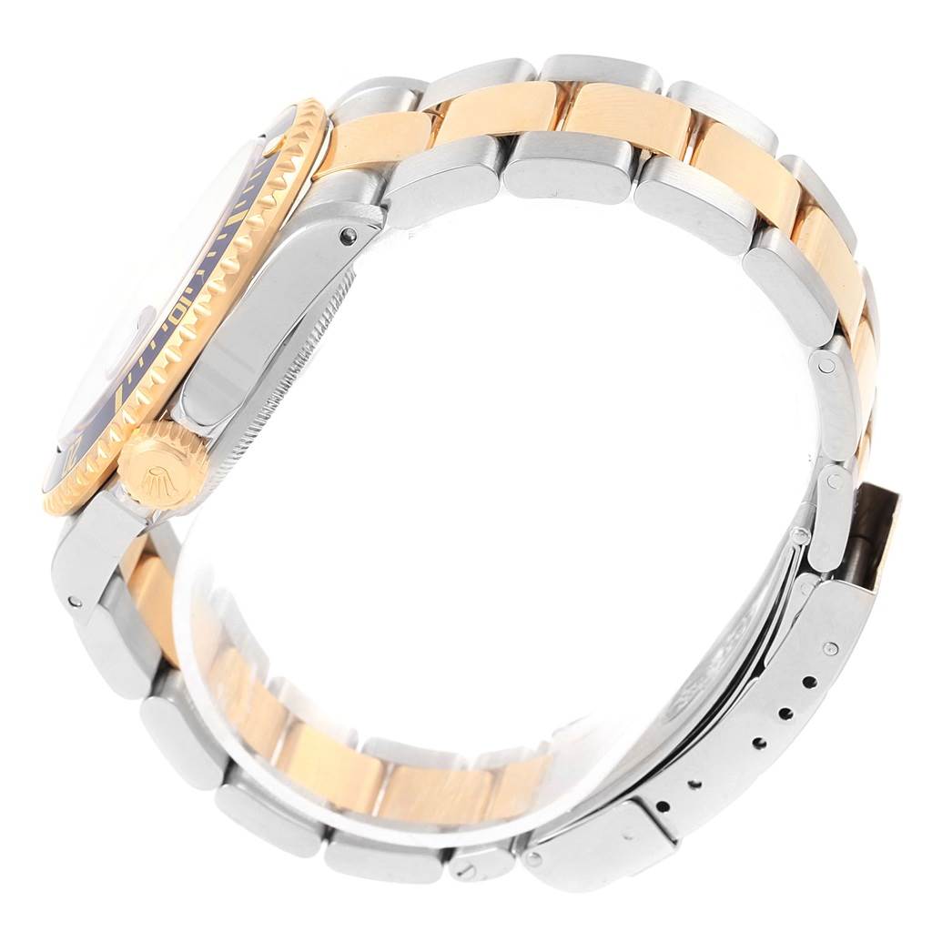 This image shows a side profile of a Rolex Submariner 16613 Men's Steel and Gold (two tone) Blue Dial 16613 Men's Steel and Gold (two tone) Blue Dial watch, highlighting the crown, bezel, and two-tone bracelet.