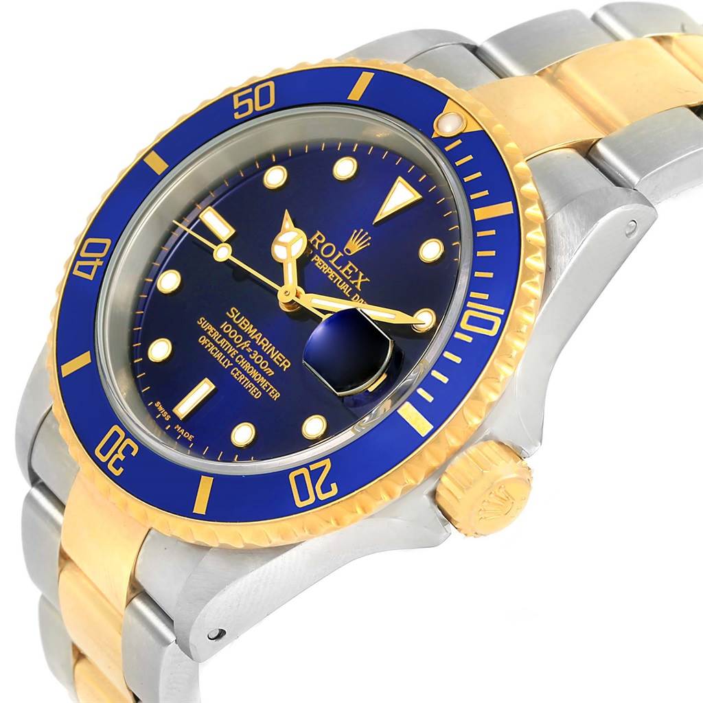 The image shows a Rolex Submariner 16613 Men's Steel and Gold (two tone) Blue Dial 16613 Men's Steel and Gold (two tone) Blue Dial model in a side angle, featuring a blue dial, gold bezel, and two-tone bracelet.