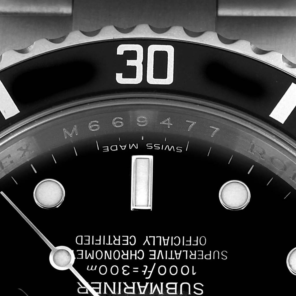 The image shows a close-up, top-down view of the bezel, dial, and part of the bracelet of a Rolex Submariner 16610 Men's Stainless Steel Black Dial 16610 Men's Stainless Steel Black Dial watch.