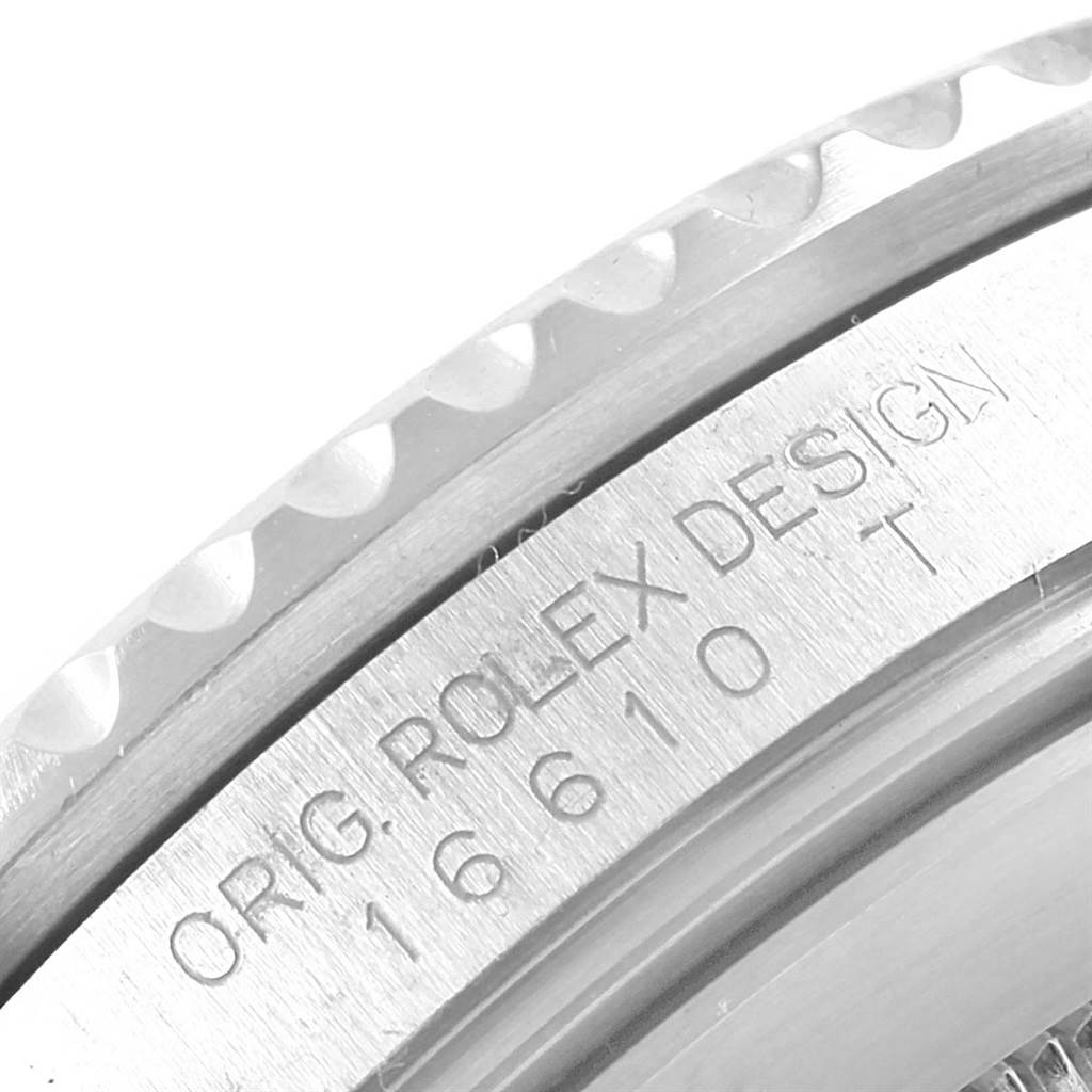 This image shows a close-up of the side engraving on a Rolex Submariner 16610 Men's Stainless Steel Black Dial 16610 Men's Stainless Steel Black Dial, focusing on the model number "16610" and "ROLEX DESIGN."