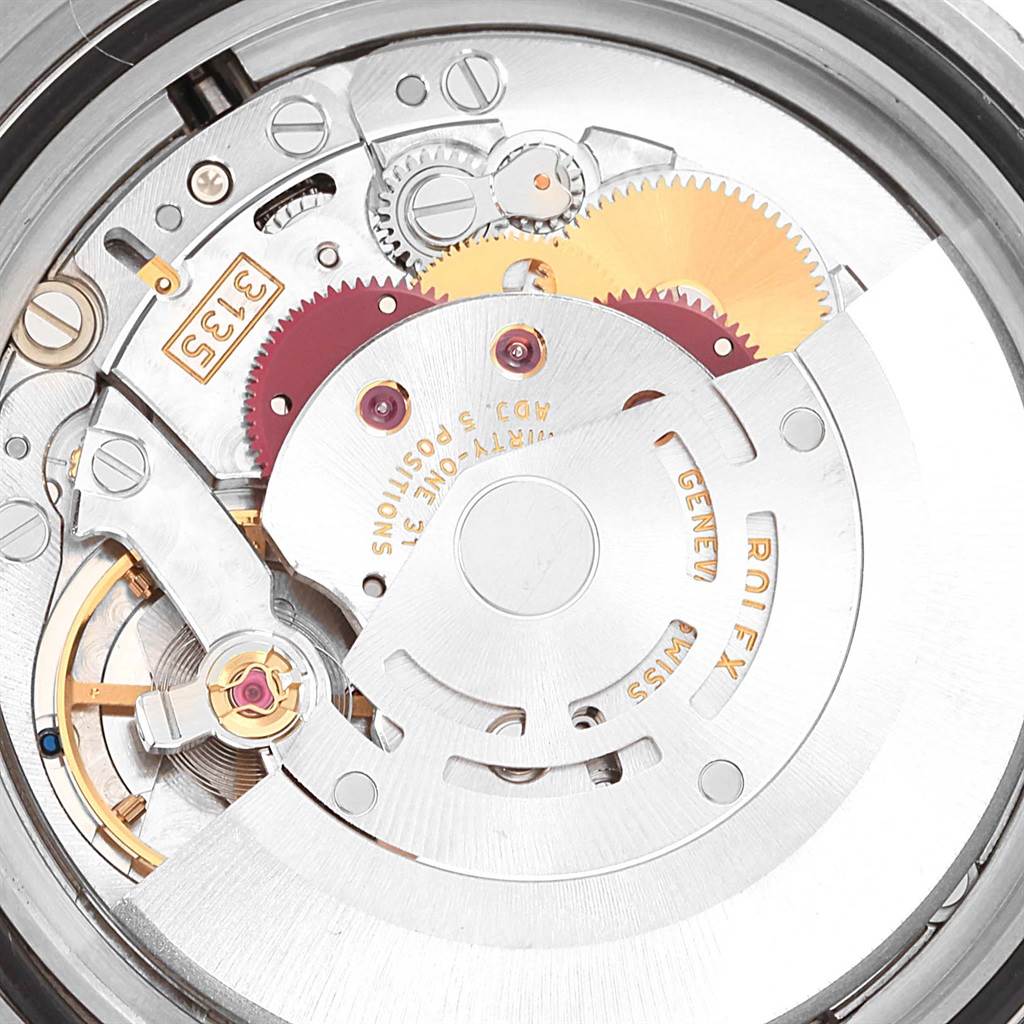 The image shows a close-up view of the movement mechanism inside a Rolex Submariner 16610 Men's Stainless Steel Black Dial 16610 Men's Stainless Steel Black Dial.