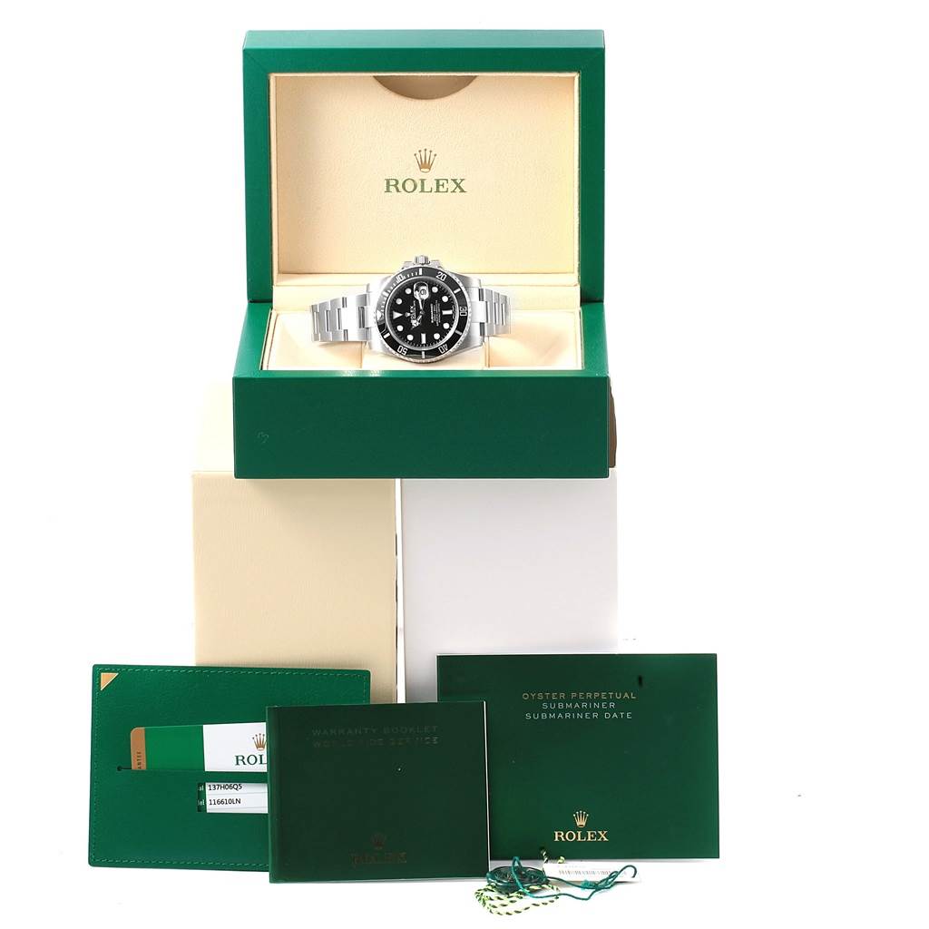 The image shows a Rolex Submariner 116610 Men's Stainless Steel Black Dial 116610 Men's Stainless Steel Black Dial watch in its box with warranty booklets and tags.