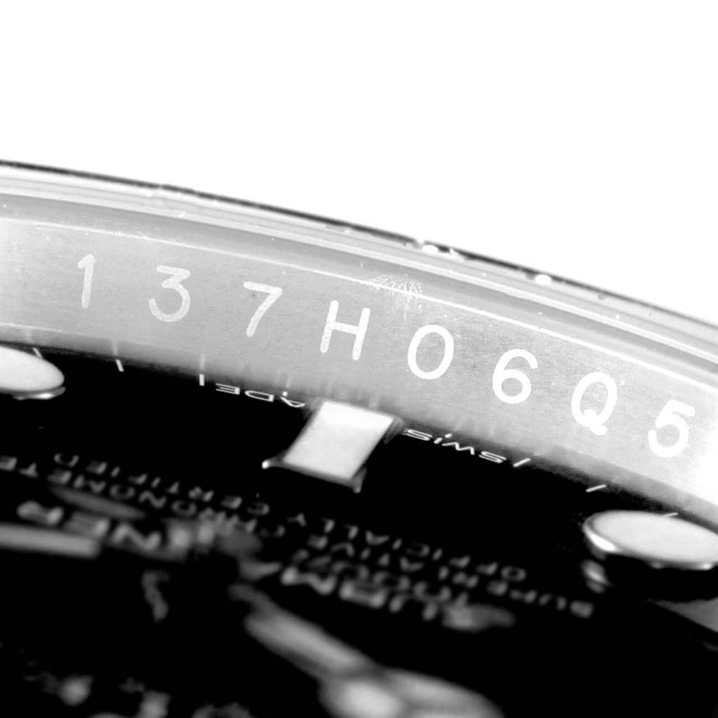 The image shows a close-up angle of the inner bezel with serial numbers of a Rolex Submariner 116610 Men's Stainless Steel Black Dial 116610 Men's Stainless Steel Black Dial watch.