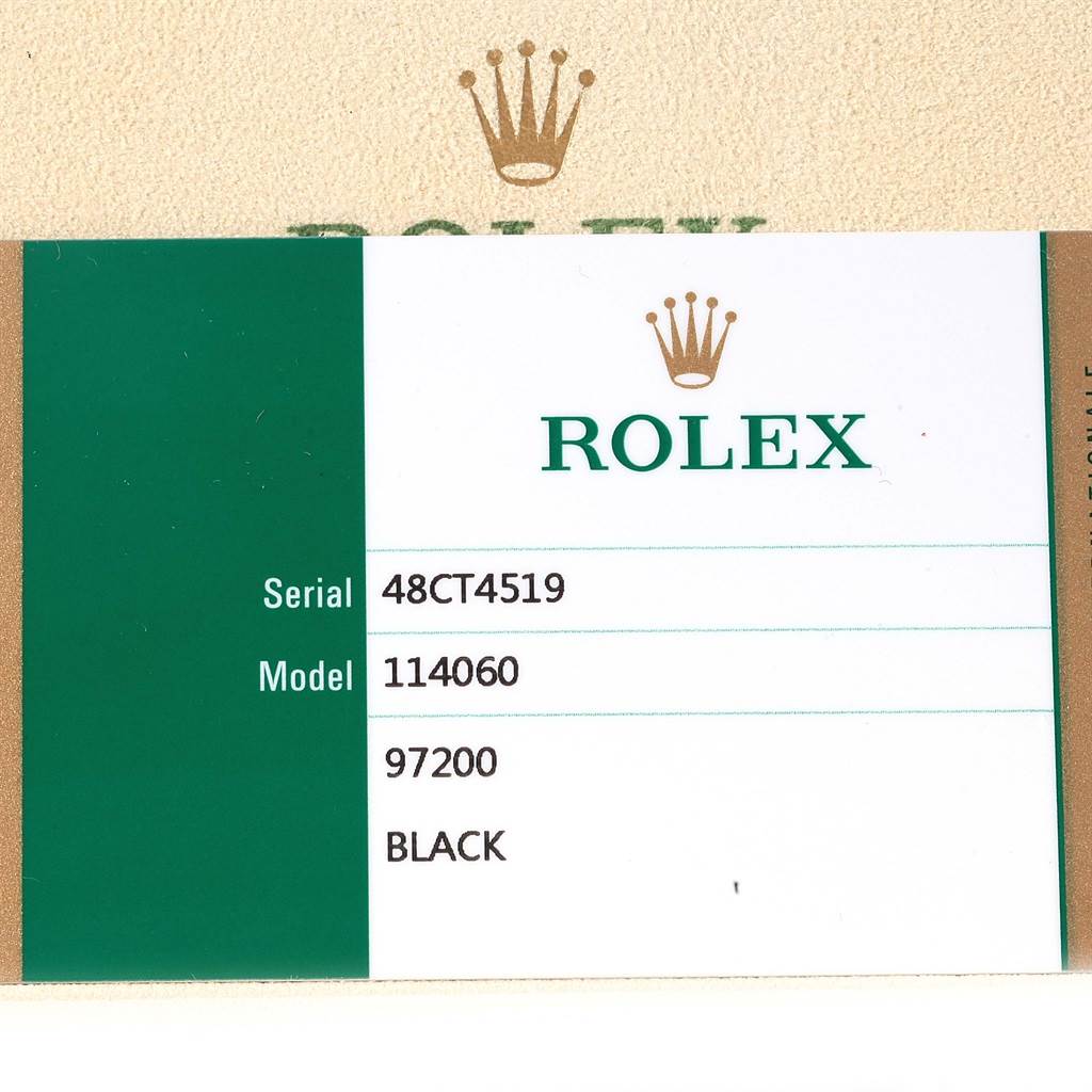 The image shows a certification card of the Rolex Submariner 114060 Men's Stainless Steel Black Dial 114060 Men's Stainless Steel Black Dial model 114060, including the serial number.