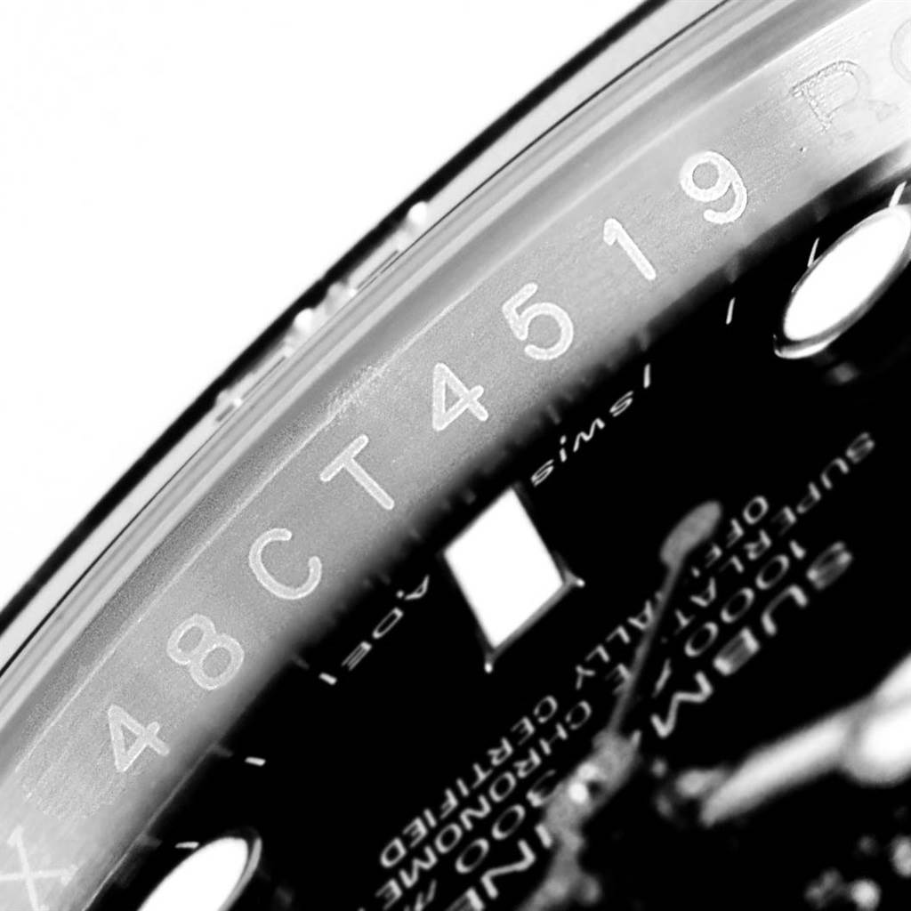 The image shows a close-up angle of the inner bezel and part of the dial of a Rolex Submariner 114060 Men's Stainless Steel Black Dial 114060 Men's Stainless Steel Black Dial watch.