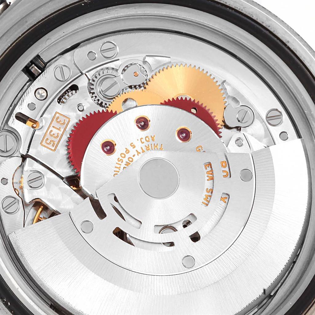 This image shows the Rolex Submariner 16613 Men's Steel and Gold (two tone) Blue Dial 16613 Men's Steel and Gold (two tone) Blue Dial's watch movement from a top-down angle, highlighting its intricate gears and components.