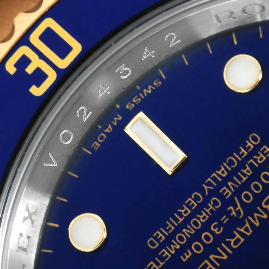 The image shows a close-up of the dial and bezel of a Rolex Submariner 16613 Men's Steel and Gold (two tone) Blue Dial 16613 Men's Steel and Gold (two tone) Blue Dial watch.