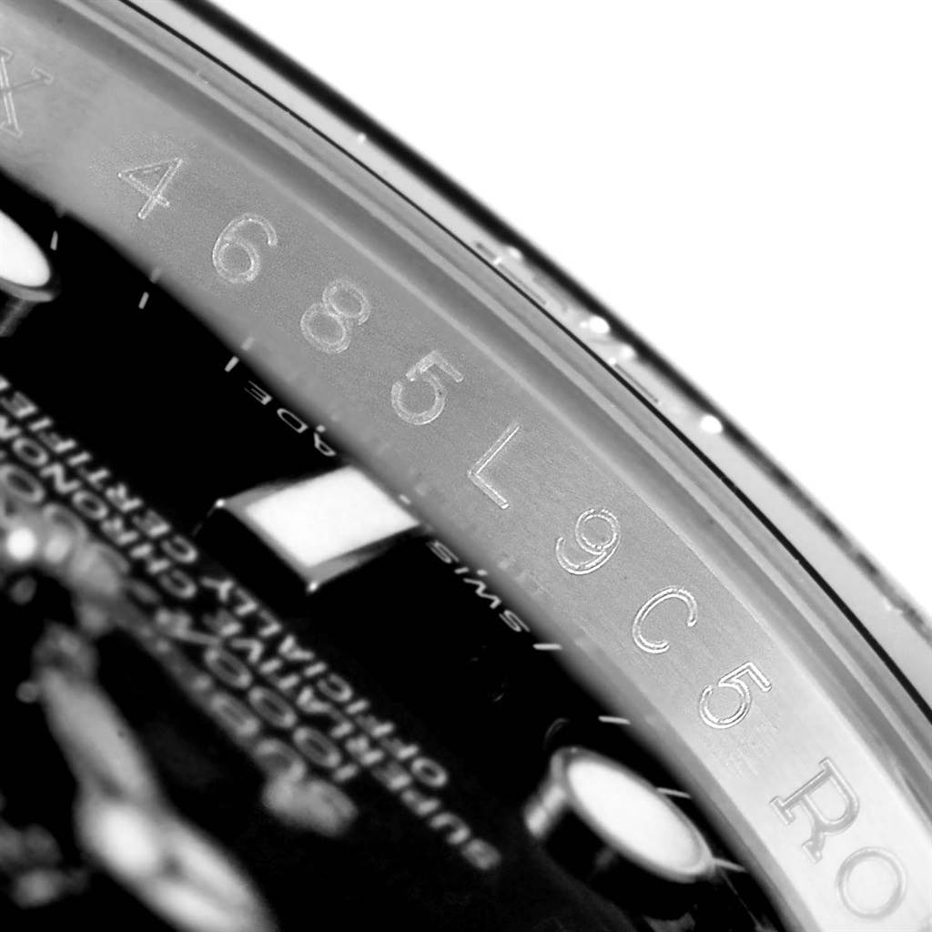This close-up image of a Rolex Submariner 116610 Men's Stainless Steel Black Dial 116610 Men's Stainless Steel Black Dial shows the serial number engraved on the inner bezel.