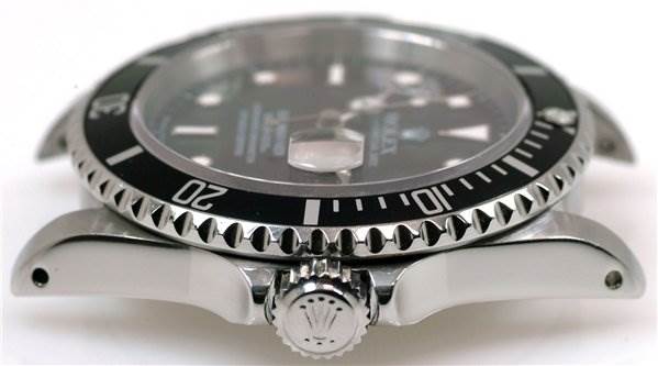The image shows a side angle of a Rolex Submariner 16610 Men's Stainless Steel Black Dial 16610 Men's Stainless Steel Black Dial watch, focusing on the bezel, crown, and case lugs.