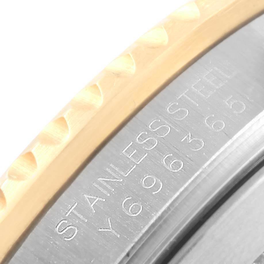 The image shows a close-up of the bezel and engraved serial number on the side of a Rolex Submariner 16613 Men's Steel and Gold (two tone) Blue Dial 16613 Men's Steel and Gold (two tone) Blue Dial watch.