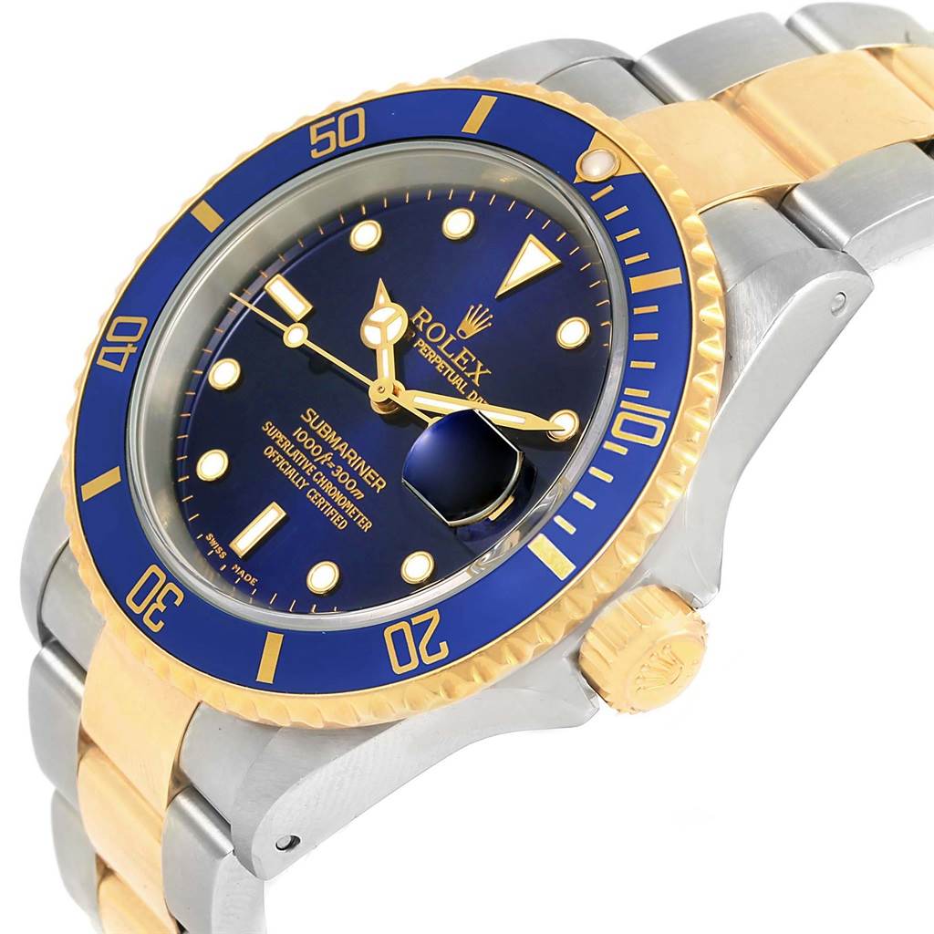 This image shows a Rolex Submariner 16613 Men's Steel and Gold (two tone) Blue Dial 16613 Men's Steel and Gold (two tone) Blue Dial watch at a slight angle, highlighting its blue dial, bezel, and gold accents on the bracelet.