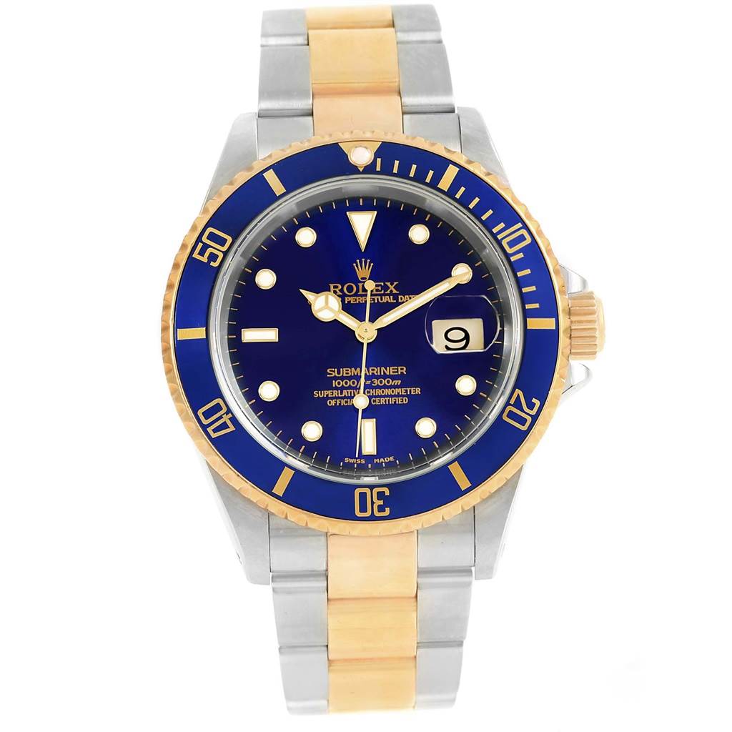 The image shows a Rolex Submariner 16613 Men's Steel and Gold (two tone) Blue Dial 16613 Men's Steel and Gold (two tone) Blue Dial watch from a front angle, highlighting its blue dial, gold bezel, and two-tone bracelet.