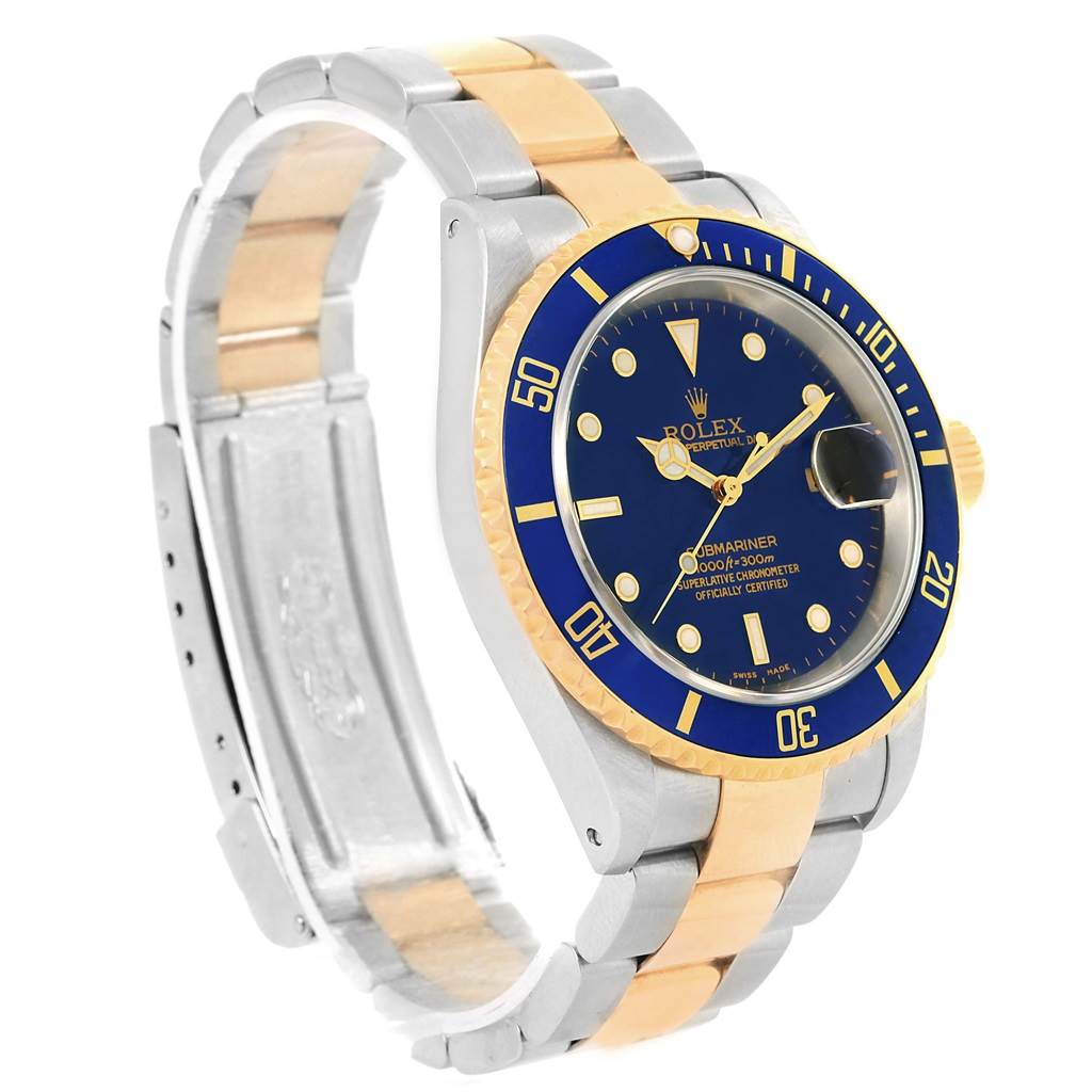 A Rolex Submariner 16613 Men's Steel and Gold (two tone) Blue Dial 16613 Men's Steel and Gold (two tone) Blue Dial watch is shown at an angle, highlighting its blue dial, bezel, gold accents, and silver-gold bracelet.