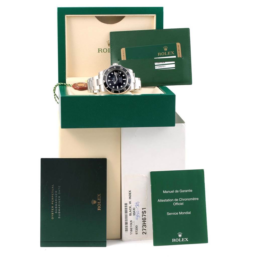 This image shows a Rolex Submariner 116610 Men's Stainless Steel Black Dial 116610 Men's Stainless Steel Black Dial watch from the front, along with its box, manual, warranty card, and other accompanying papers.