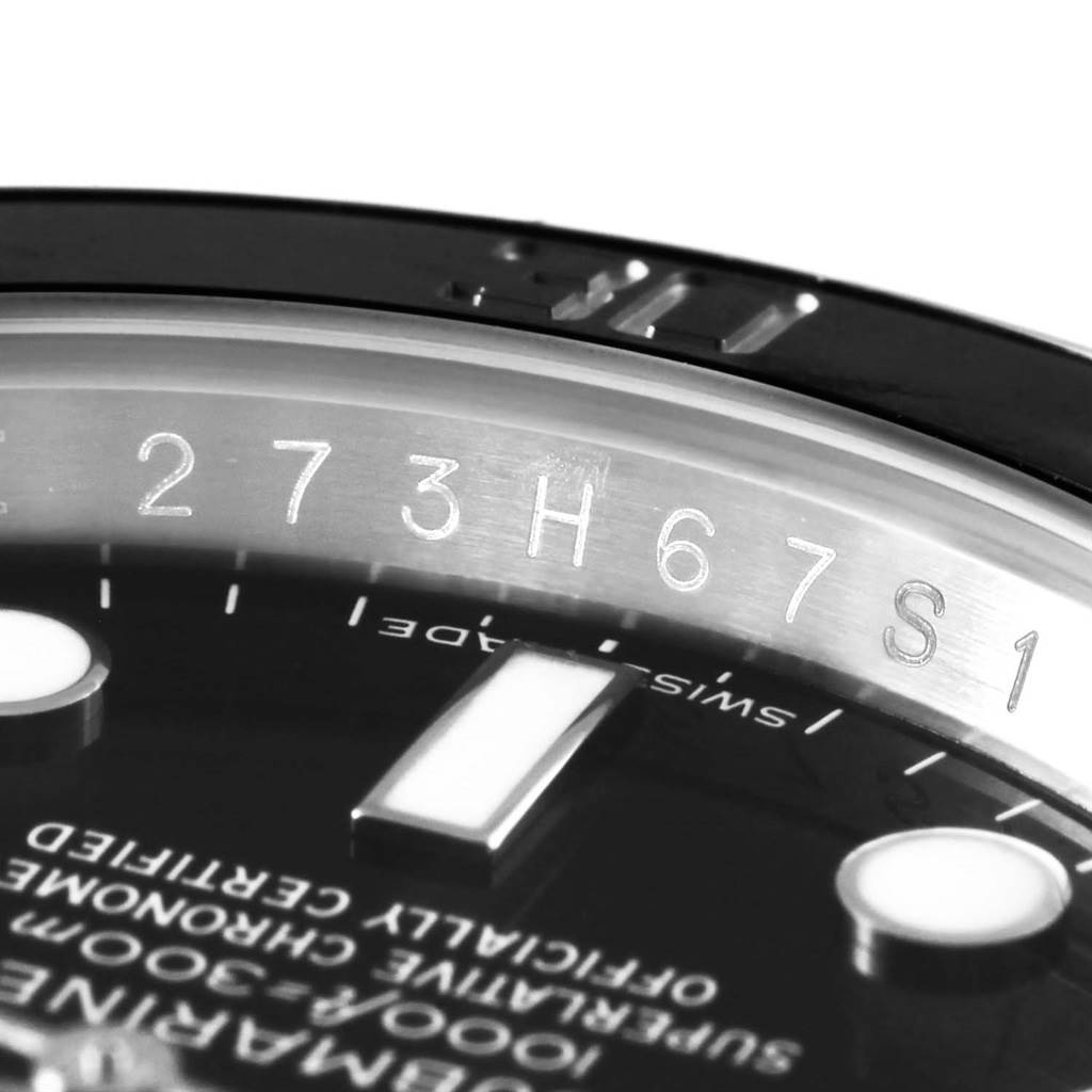 The image shows a close-up angle of the dial and rehaut engraving of a Rolex Submariner 116610 Men's Stainless Steel Black Dial 116610 Men's Stainless Steel Black Dial watch.