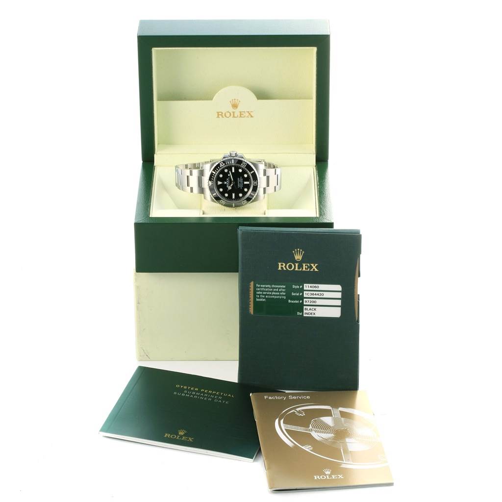 The image shows a Rolex Submariner 114060 Men's Stainless Steel Black Dial 114060 Men's Stainless Steel Black Dial watch in its box, accompanied by its warranty card and manuals.