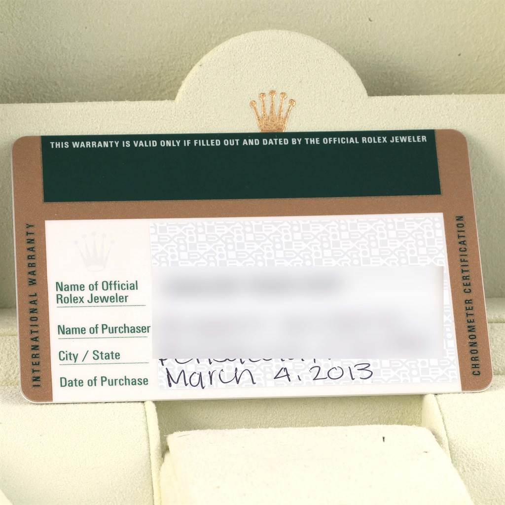 The image shows an International Warranty card for a Rolex Submariner 114060 Men's Stainless Steel Black Dial 114060 Men's Stainless Steel Black Dial with information fields and a Rolex logo.