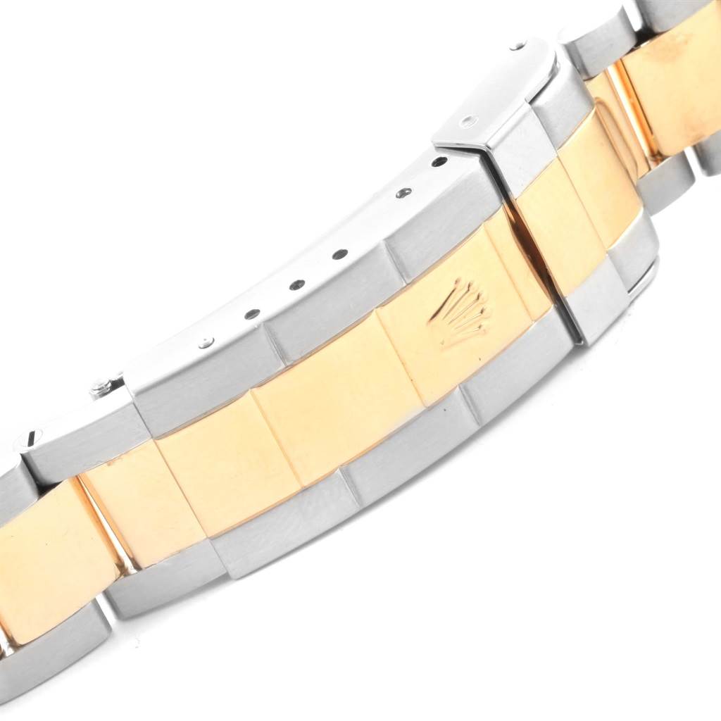 The image shows a close-up of the bi-color bracelet and clasp of a Rolex Submariner 16613 Men's Steel and Gold (two tone) Blue Dial 16613 Men's Steel and Gold (two tone) Blue Dial watch.