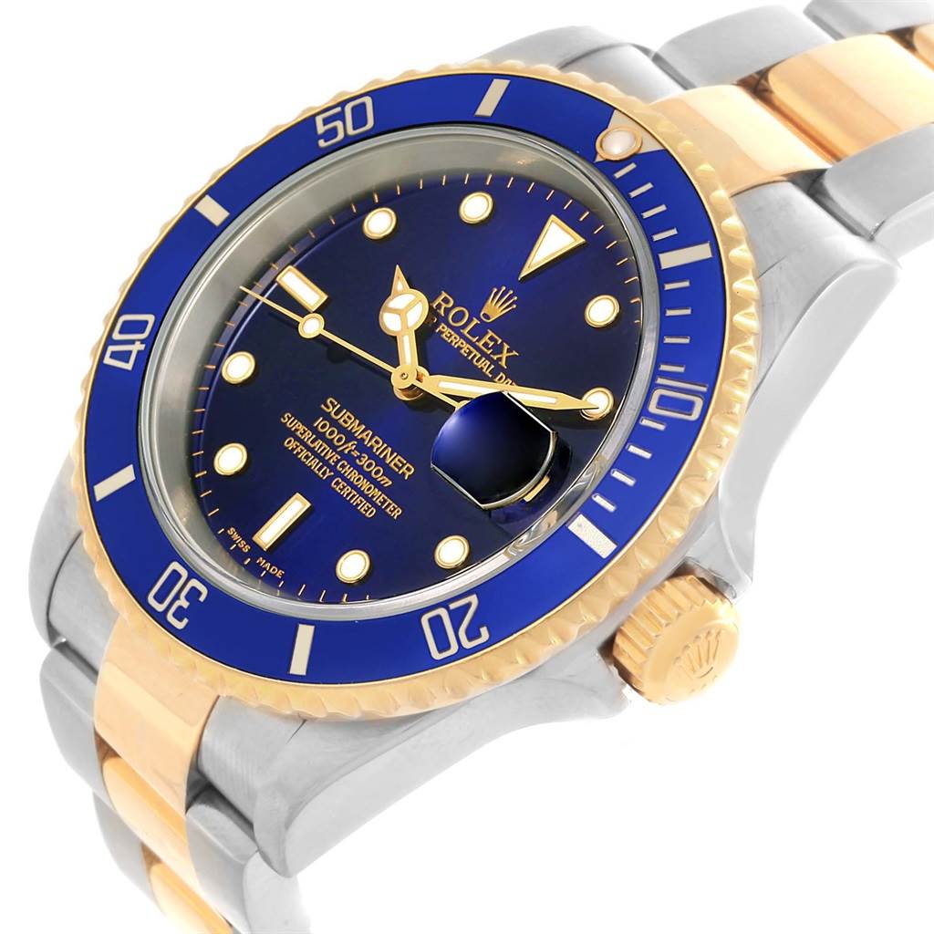 This image shows a Rolex Submariner 16613 Men's Steel and Gold (two tone) Blue Dial 16613 Men's Steel and Gold (two tone) Blue Dial watch from an oblique angle, highlighting its blue dial, bezel, and two-tone bracelet.