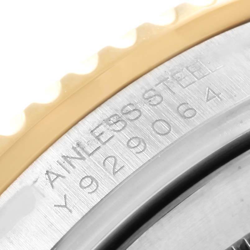 This close-up image shows the stainless steel bezel and edge of the dial of a Rolex Submariner 16613 Men's Steel and Gold (two tone) Blue Dial 16613 Men's Steel and Gold (two tone) Blue Dial watch.