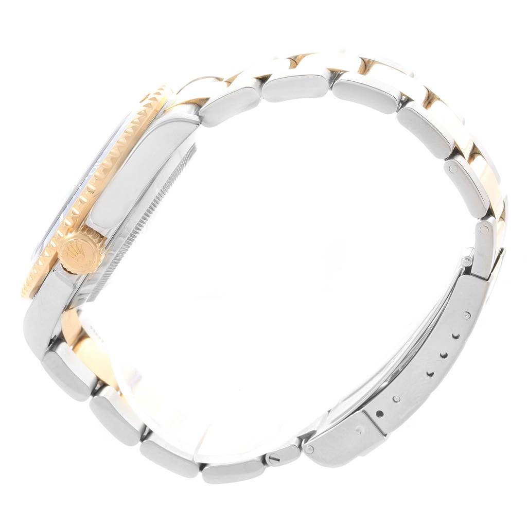 This image shows a side profile of a Rolex Submariner 16613 Men's Steel and Gold (two tone) Blue Dial 16613 Men's Steel and Gold (two tone) Blue Dial watch, highlighting its crown, bezel, and two-tone bracelet.