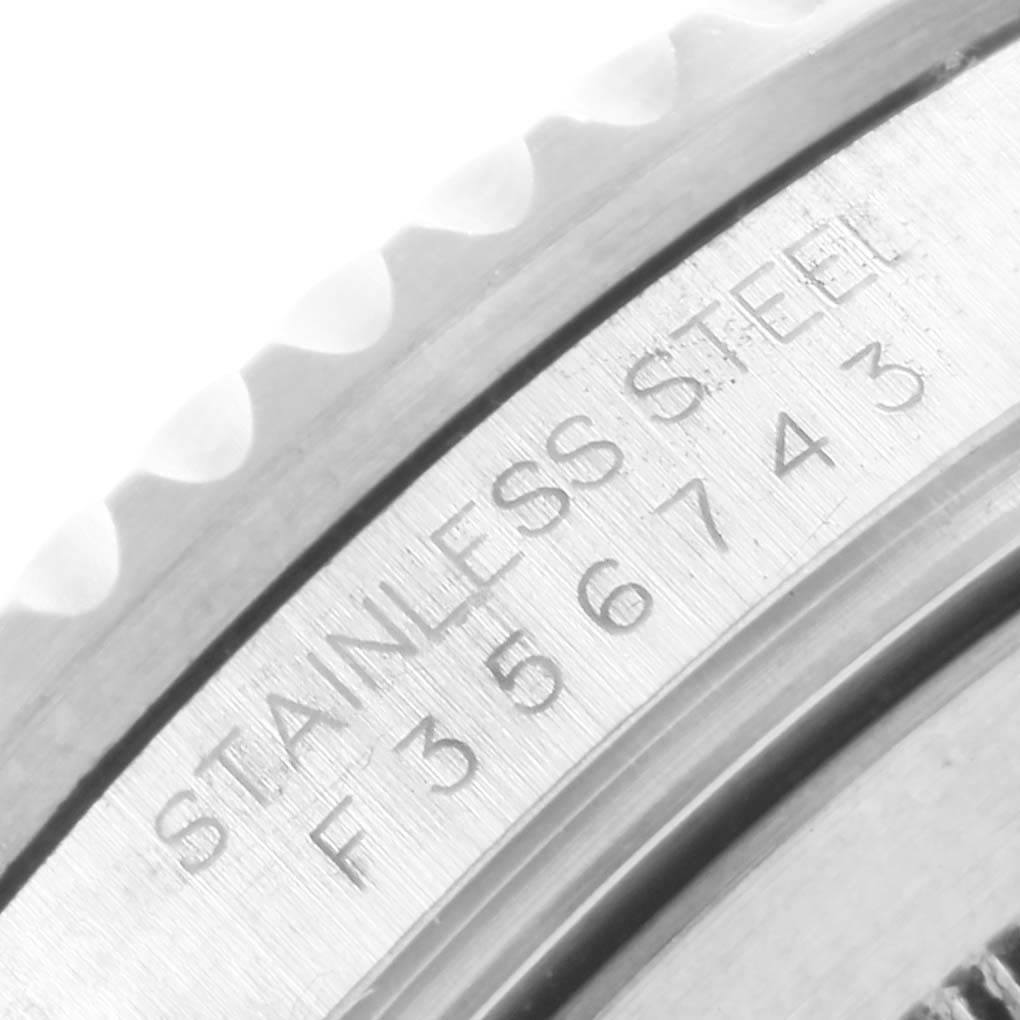 This image shows a close-up of the serial number and "STAINLESS STEEL" inscription on a Rolex Submariner 16610 Men's Stainless Steel Black Dial 16610 Men's Stainless Steel Black Dial watch's case.