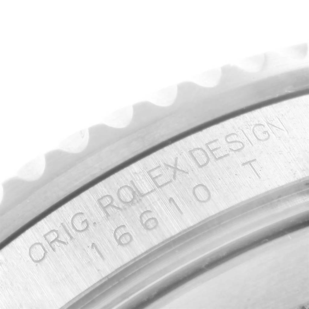 This image shows a close-up of the side engraving on a Rolex Submariner 16610 Men's Stainless Steel Black Dial 16610 Men's Stainless Steel Black Dial watch, highlighting "ORIG. ROLEX DESIGN" and model number "16610 T".