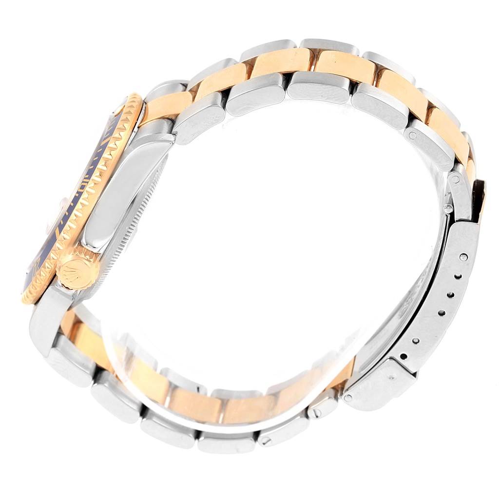 This image shows a side profile of a Rolex Submariner 16613 Men's Steel and Gold (two tone) Grey Dial 16613 Men's Steel and Gold (two tone) Grey Dial watch, highlighting its two-tone bracelet and crown.