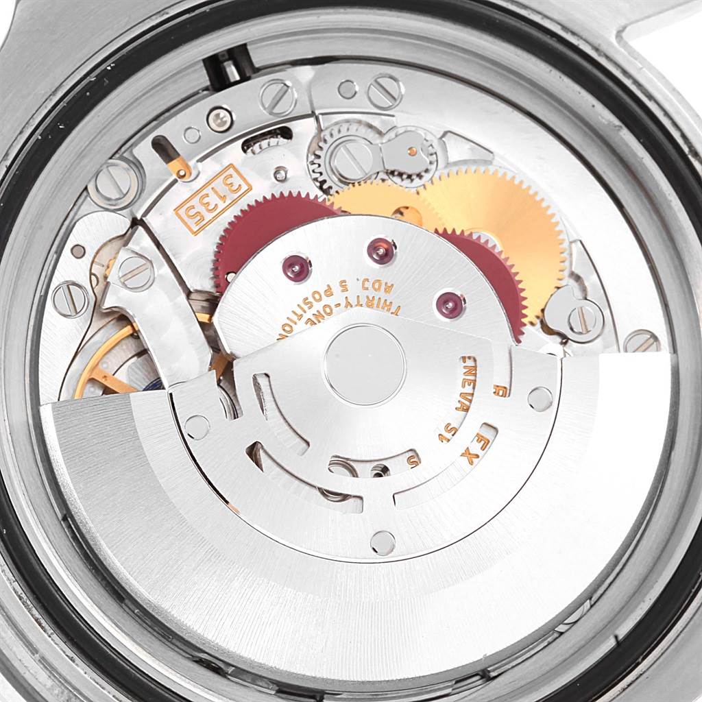 The image shows a close-up view of the inner mechanical movement of a Rolex Submariner 116610 Men's Stainless Steel Black Dial 116610 Men's Stainless Steel Black Dial watch.