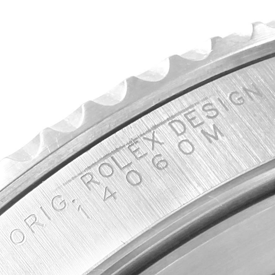 This image shows a close-up of the engraved bezel and edge of the Rolex Submariner 14060 Men's Stainless Steel Black Dial 14060 Men's Stainless Steel Black Dial watch.