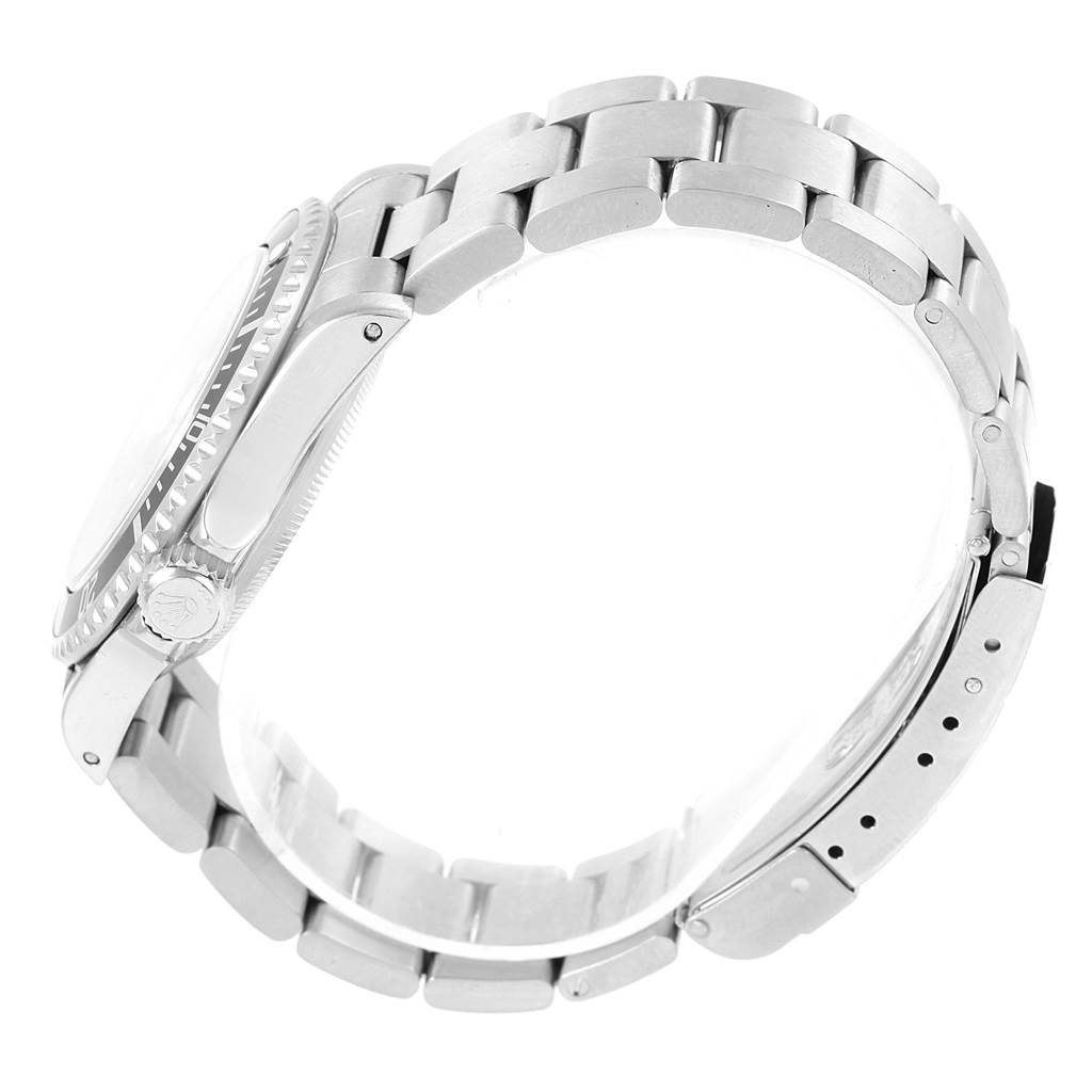 The Rolex Submariner 14060 Men's Stainless Steel Black Dial 14060 Men's Stainless Steel Black Dial watch is shown from a side angle, highlighting the case, crown, and metal bracelet.