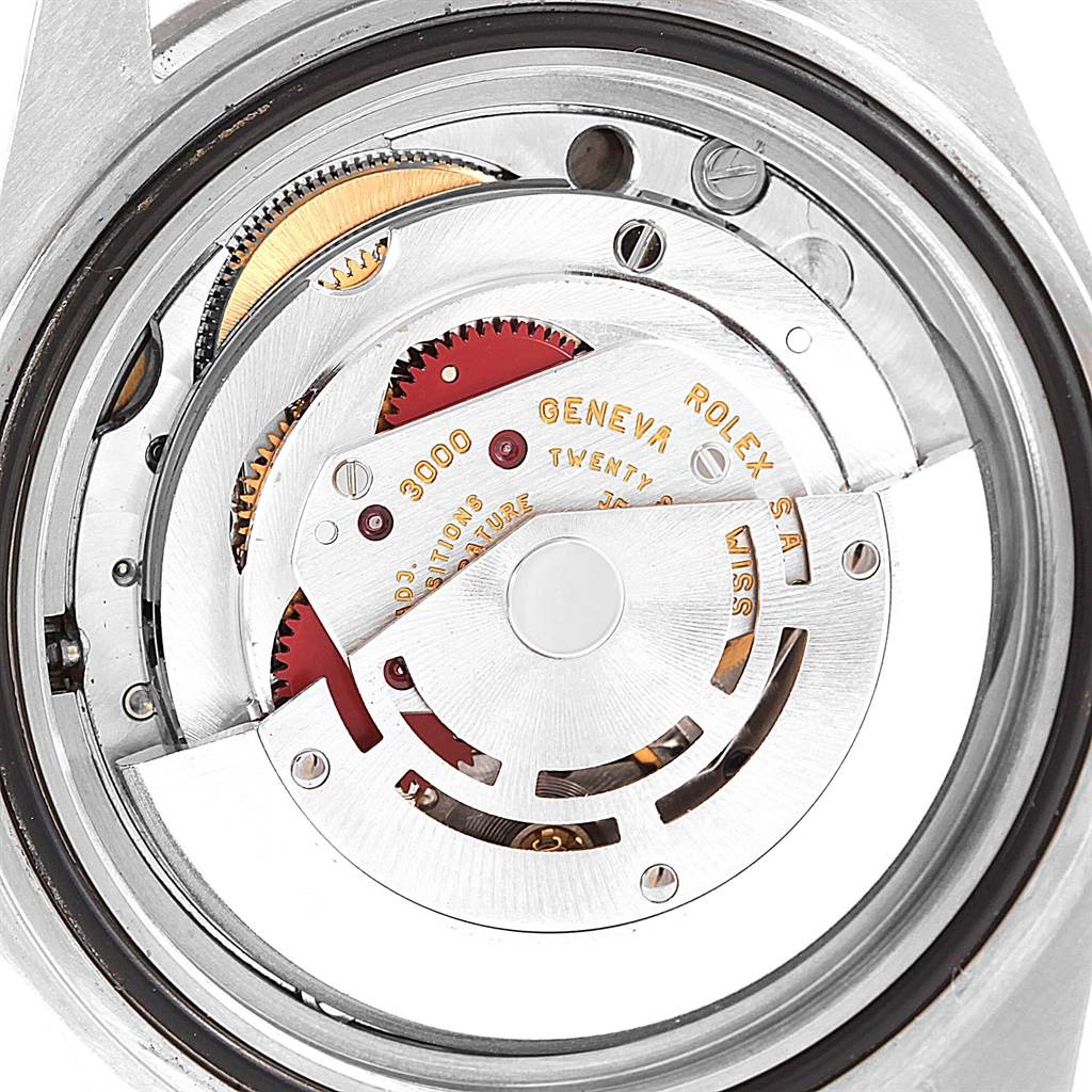 This image shows the inner mechanism and movement components of a Rolex Submariner 14060 Men's Stainless Steel Black Dial 14060 Men's Stainless Steel Black Dial watch from the back.
