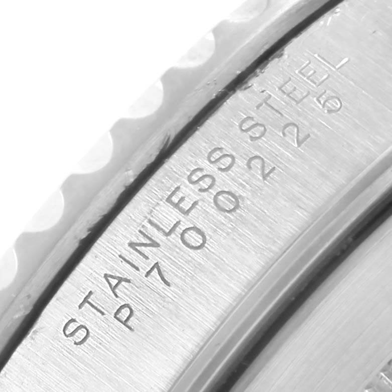 The image shows a close-up of the side engravings on the bezel of a Rolex Submariner 14060 Men's Stainless Steel Black Dial 14060 Men's Stainless Steel Black Dial.