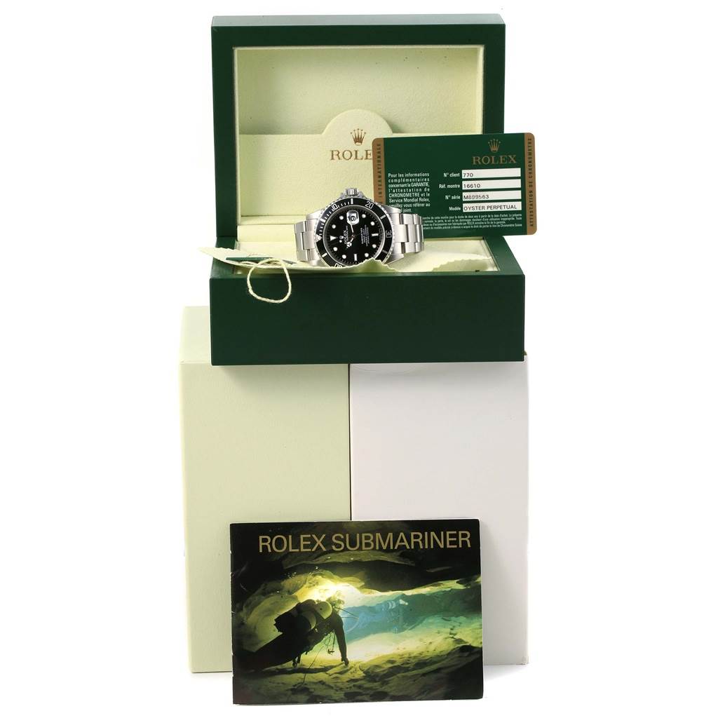 The image shows a Rolex Submariner 16610 Men's Stainless Steel Black Dial 16610 Men's Stainless Steel Black Dial watch in an open box with warranty card and booklet, viewed from the front.