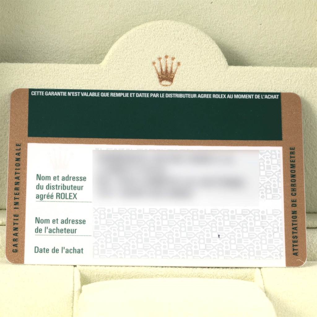 The image shows a warranty card for a Rolex Submariner 16610 Men's Stainless Steel Black Dial 16610 Men's Stainless Steel Black Dial, displaying the brand's logo and fields for distributor and purchaser information.