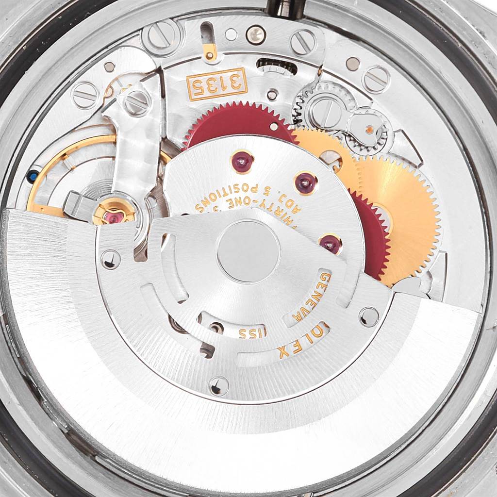 This image shows the inner mechanical movement of a Rolex Submariner 16610 Men's Stainless Steel Black Dial 16610 Men's Stainless Steel Black Dial watch with gears and the rotor visible.
