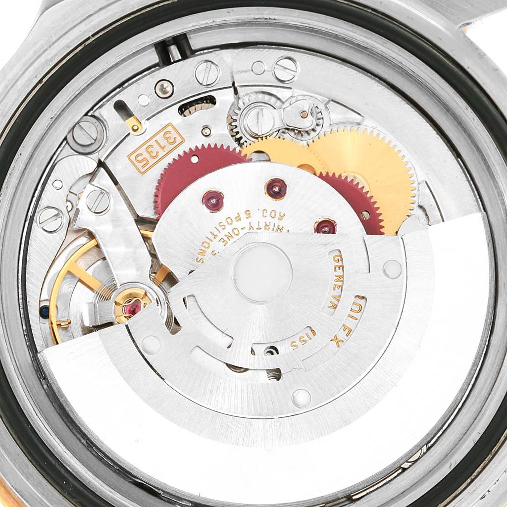 This is a close-up view of the internal mechanism of a Rolex Submariner 16613 Men's Steel and Gold (two tone) Blue Dial 16613 Men's Steel and Gold (two tone) Blue Dial watch.