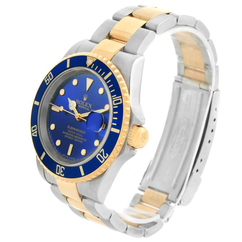 This image shows the full Rolex Submariner 16613 Men's Steel and Gold (two tone) Blue Dial 16613 Men's Steel and Gold (two tone) Blue Dial watch at an oblique angle, highlighting its blue dial, gold details, and two-tone bracelet.